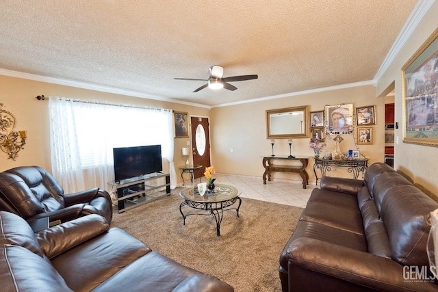 living room featuring light tile patterned floors, ceiling fan, ornamental molding, and a textured ceiling