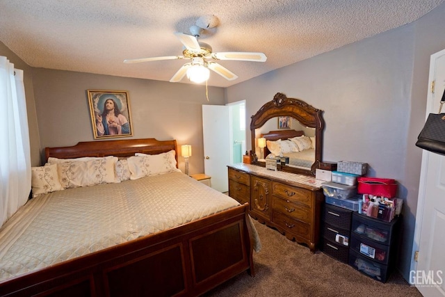 bedroom with carpet floors, ceiling fan, and a textured ceiling