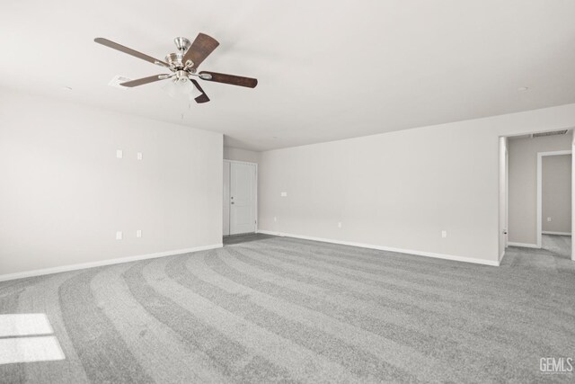 707 Poinsettia St, Bakersfield, CA 93307 - unfurnished room featuring carpet, ceiling fan, and baseboards