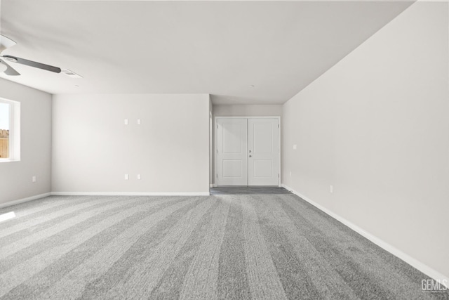 707 Poinsettia St, Bakersfield, CA 93307 - carpeted spare room with a ceiling fan and baseboards