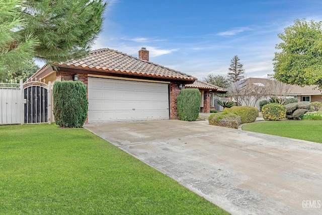 view of front of property featuring a garage and a front lawn