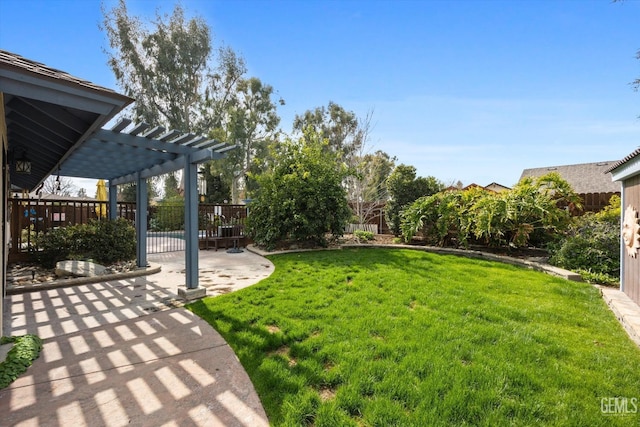 view of yard with a patio area, a fenced backyard, and a pergola