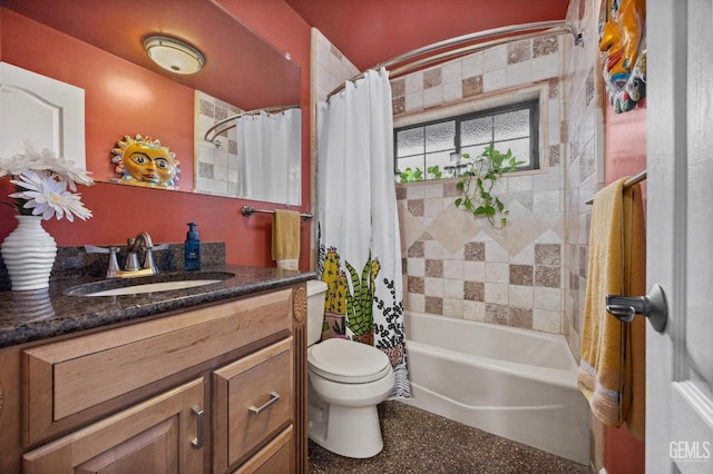 full bath with shower / tub combo, vanity, and toilet