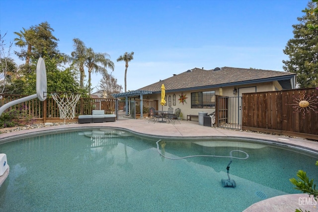 view of pool featuring a patio, fence, and a fenced in pool