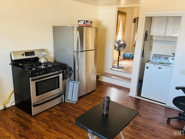 104 E Kern St, Taft, CA 93268 - kitchen with appliances with stainless steel finishes, washer / clothes dryer, dark wood-style floors, and baseboards