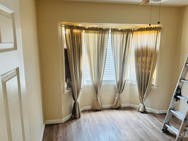 104 E Kern St, Taft, CA 93268 - unfurnished room featuring wood finished floors and baseboards