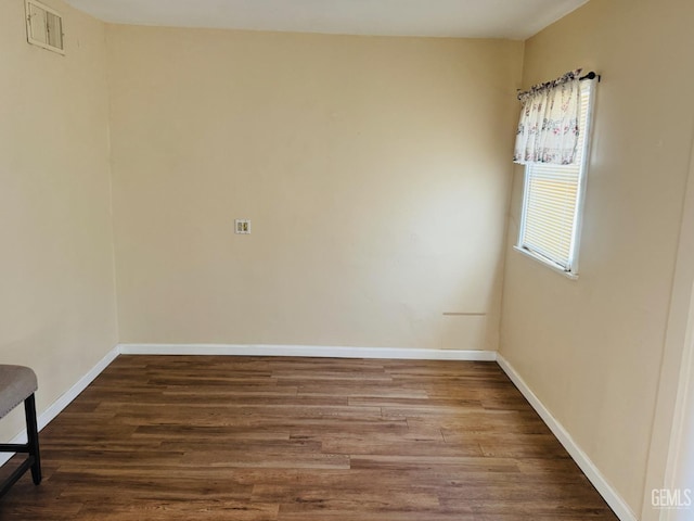 104 E Kern St, Taft, CA 93268 - unfurnished room featuring wood finished floors and baseboards