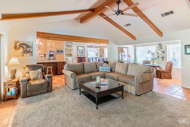 living room with light tile patterned flooring, visible vents, ceiling fan, and vaulted ceiling with beams