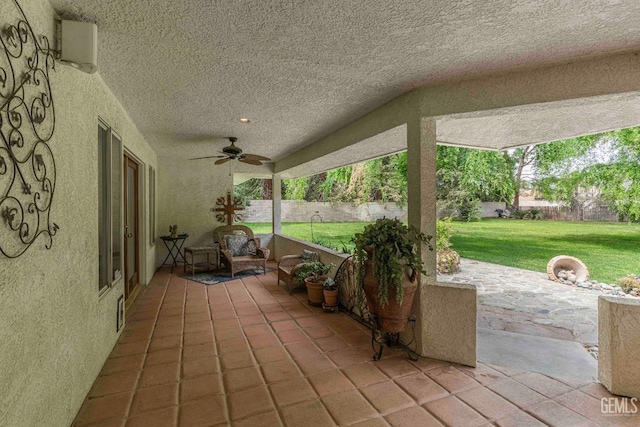 view of patio with ceiling fan and fence private yard