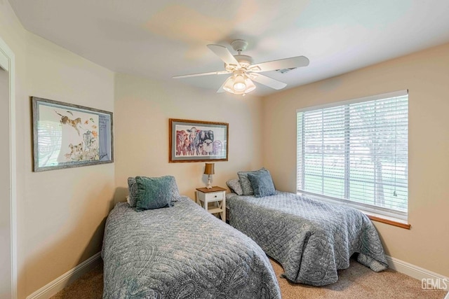 bedroom with carpet, ceiling fan, and baseboards