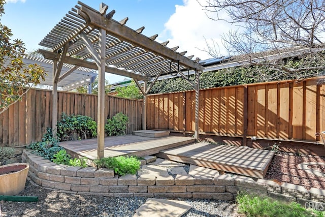 view of patio featuring a wooden deck and a pergola