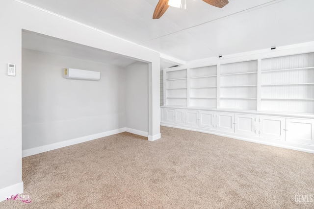 basement featuring ceiling fan, light colored carpet, and a wall unit AC