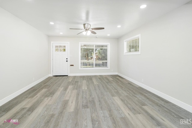 interior space with ceiling fan and light hardwood / wood-style flooring