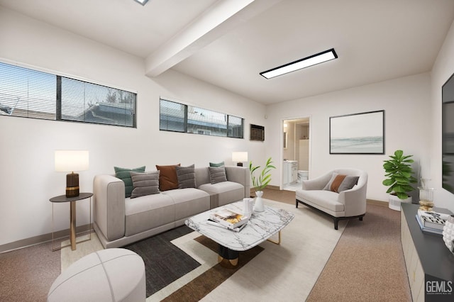 carpeted living room featuring beam ceiling