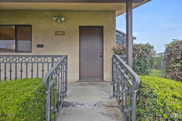 doorway to property featuring covered porch