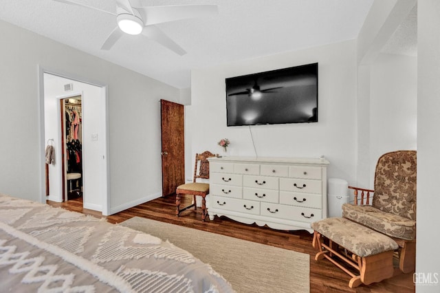 2316 Gosford Rd Unit R, Bakersfield, CA 93309 - bedroom with wood finished floors, a walk in closet, a ceiling fan, and a closet