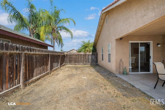 2119 Maganda Ave, Delano, CA 93215 - fenced backyard featuring a patio area