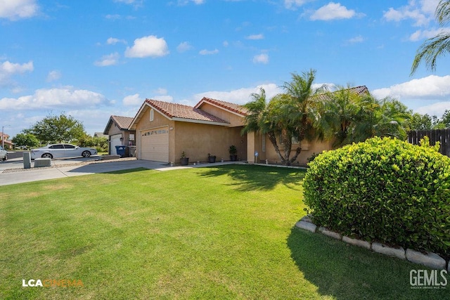 2119 Maganda Ave, Delano, CA 93215 - view of front facade featuring stucco siding, a tiled roof, concrete driveway, and an attached garage