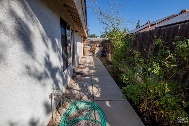 view of property exterior featuring fence and stucco siding