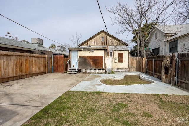 view of yard with central AC and a patio area