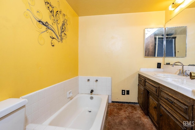 bathroom with vanity, toilet, and a bath