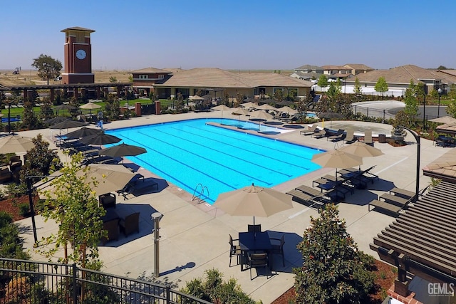 12820 Graham Ct, Bakersfield, CA 93311 - community pool with a patio and a residential view