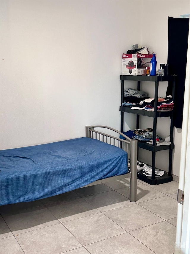 bedroom with light tile patterned floors