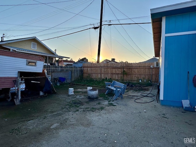 view of yard at dusk