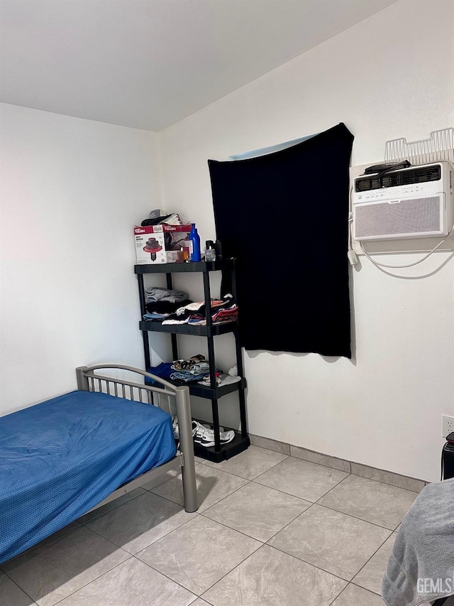 tiled bedroom with a wall unit AC