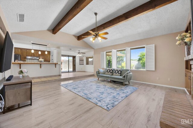 9408 Wandering Oak Dr, Bakersfield, CA 93311 - living area with ceiling fan, a textured ceiling, light wood-type flooring, and baseboards