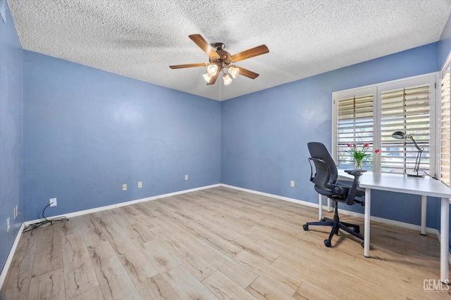 9408 Wandering Oak Dr, Bakersfield, CA 93311 - unfurnished office with ceiling fan, wood finished floors, a textured ceiling, and baseboards