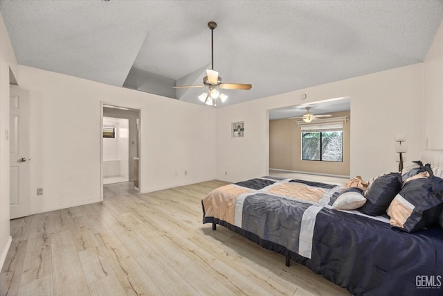 9408 Wandering Oak Dr, Bakersfield, CA 93311 - bedroom featuring wood finished floors, lofted ceiling, a ceiling fan, a textured ceiling, and ensuite bath
