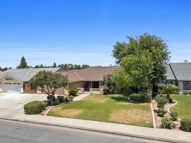 9408 Wandering Oak Dr, Bakersfield, CA 93311 - view of front of home featuring concrete driveway, an attached garage, a front yard, and stucco siding