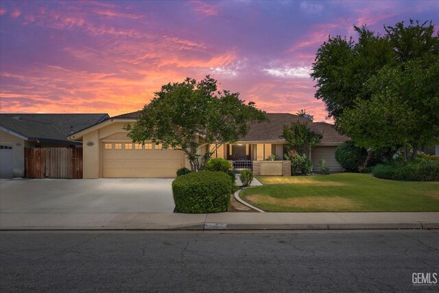 9408 Wandering Oak Dr, Bakersfield, CA 93311 - single story home featuring a garage, driveway, and stucco siding