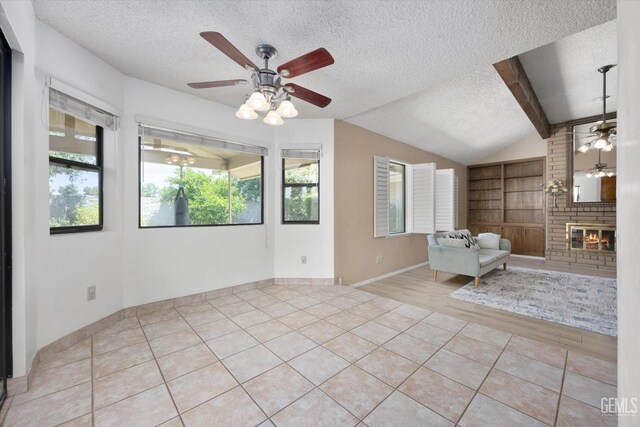 9408 Wandering Oak Dr, Bakersfield, CA 93311 - unfurnished living room with ceiling fan, a textured ceiling, vaulted ceiling, built in features, and light tile patterned flooring