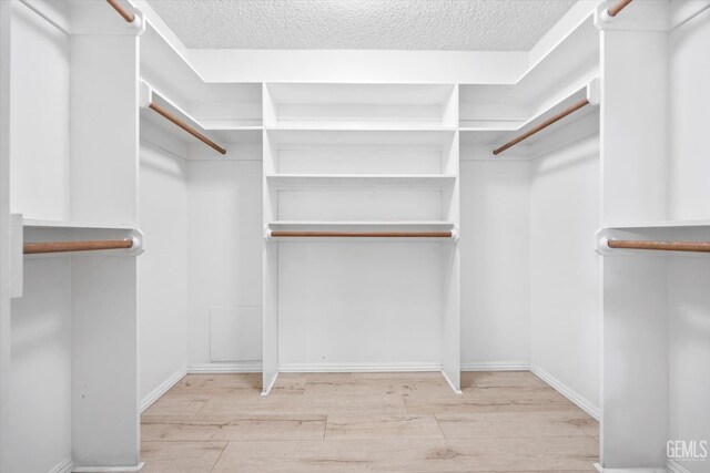 9408 Wandering Oak Dr, Bakersfield, CA 93311 - spacious closet with wood finished floors