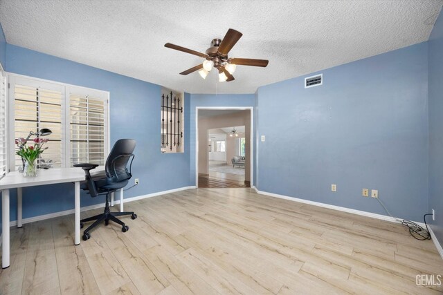 9408 Wandering Oak Dr, Bakersfield, CA 93311 - office area with a ceiling fan, wood finished floors, a textured ceiling, and baseboards