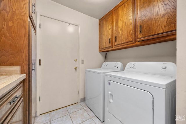 9408 Wandering Oak Dr, Bakersfield, CA 93311 - washroom featuring cabinet space, separate washer and dryer, and light tile patterned floors