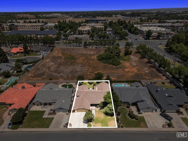 9408 Wandering Oak Dr, Bakersfield, CA 93311 - aerial overview of property's location with property boundaries highlighted and nearby suburban area
