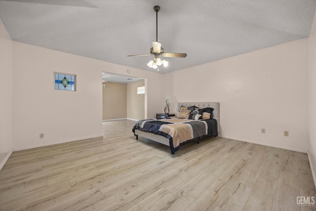 9408 Wandering Oak Dr, Bakersfield, CA 93311 - bedroom with wood finished floors, a textured ceiling, baseboards, and a ceiling fan