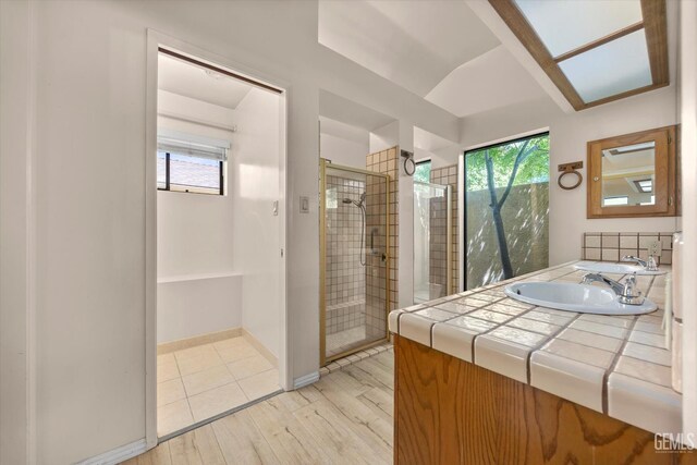 9408 Wandering Oak Dr, Bakersfield, CA 93311 - bathroom with a shower stall, vanity, and wood finished floors