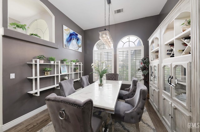 10505 Finchley Dr, Bakersfield, CA 93311 - dining area featuring dark wood-style floors, a chandelier, and baseboards