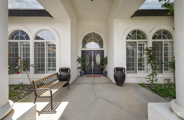 10505 Finchley Dr, Bakersfield, CA 93311 - view of exterior entry with french doors and stucco siding