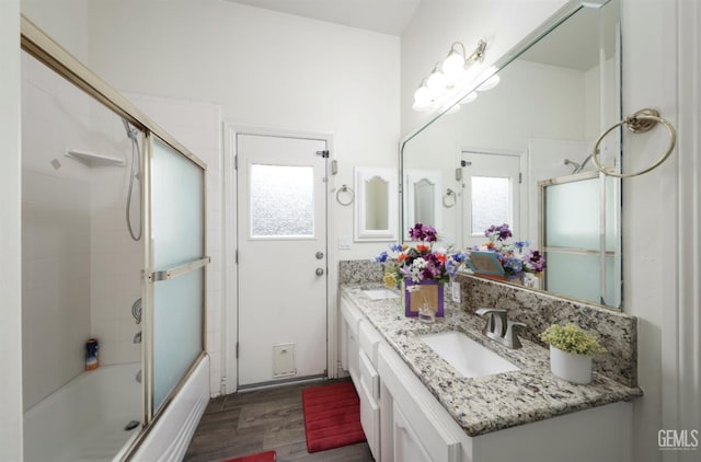 10505 Finchley Dr, Bakersfield, CA 93311 - bathroom with wood finished floors, double vanity, and combined bath / shower with glass door