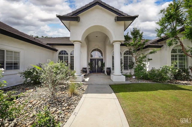 10505 Finchley Dr, Bakersfield, CA 93311 - doorway to property with french doors, stucco siding, and a yard