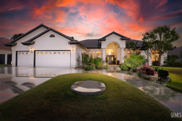 10505 Finchley Dr, Bakersfield, CA 93311 - view of front facade with a front yard, stucco siding, an attached garage, and concrete driveway