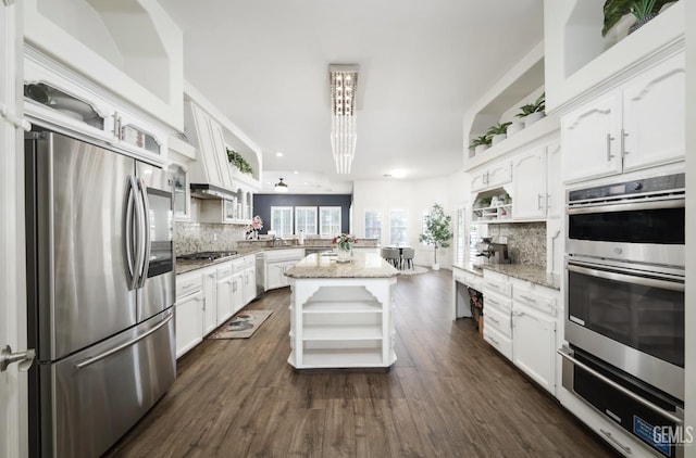 10505 Finchley Dr, Bakersfield, CA 93311 - kitchen featuring open shelves, stainless steel appliances, a warming drawer, white cabinets, and backsplash