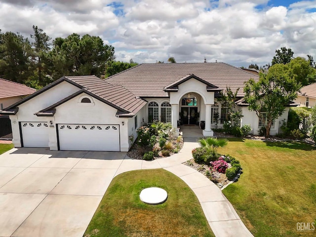 10505 Finchley Dr, Bakersfield, CA 93311 - view of front of home featuring stucco siding, driveway, an attached garage, and a front yard