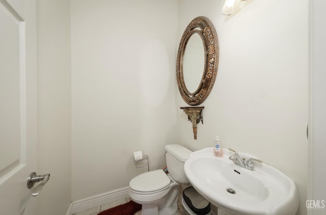10505 Finchley Dr, Bakersfield, CA 93311 - half bath featuring a sink, toilet, and tile patterned floors