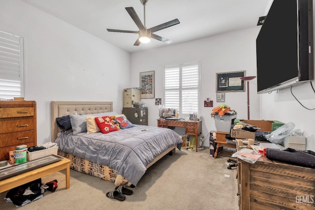 bedroom with ceiling fan and light carpet